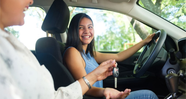 Woman handing keys to the driver